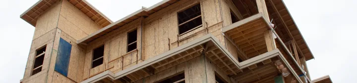 Framed residential building under construction in Langley.